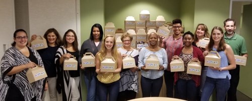 PRMS employees pose with Kraftlove boxes which will be donated to hospitalized children